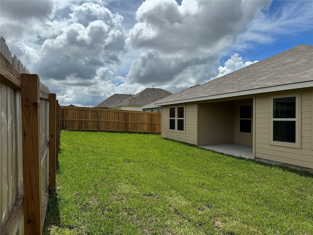 view of yard featuring a fenced backyard and a patio area