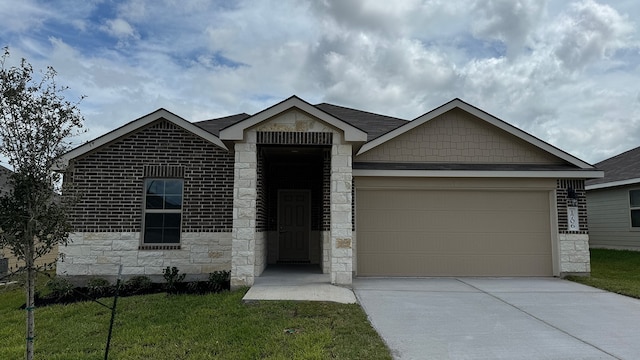 view of front facade with a front yard and a garage