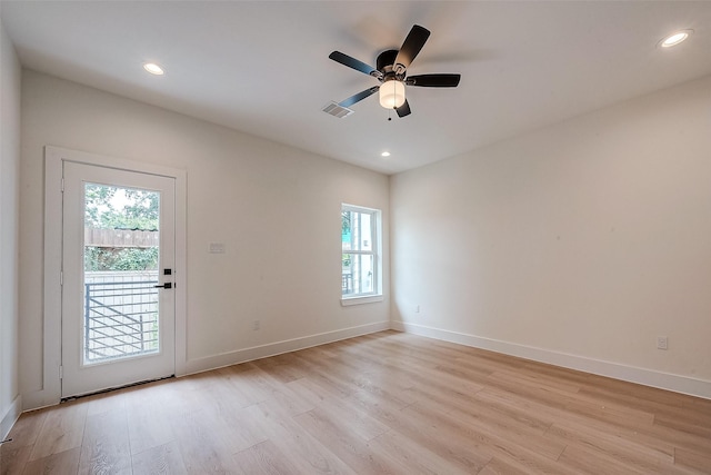 spare room with ceiling fan and light hardwood / wood-style flooring