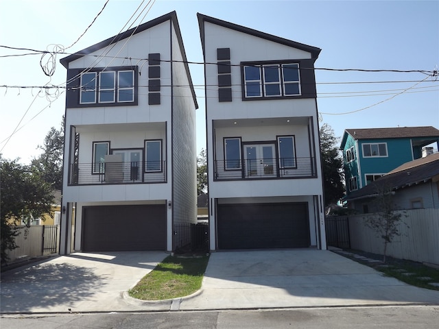 modern home featuring a balcony and a garage