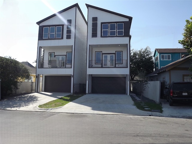 modern home featuring a garage and a balcony