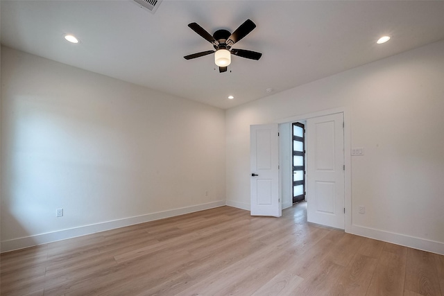 unfurnished room with ceiling fan and light hardwood / wood-style floors