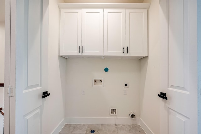 clothes washing area with gas dryer hookup, electric dryer hookup, cabinets, and hookup for a washing machine