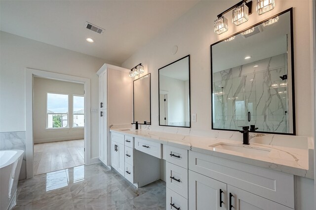 bathroom featuring separate shower and tub and vanity