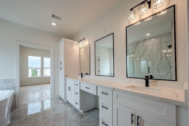 bathroom featuring separate shower and tub and vanity