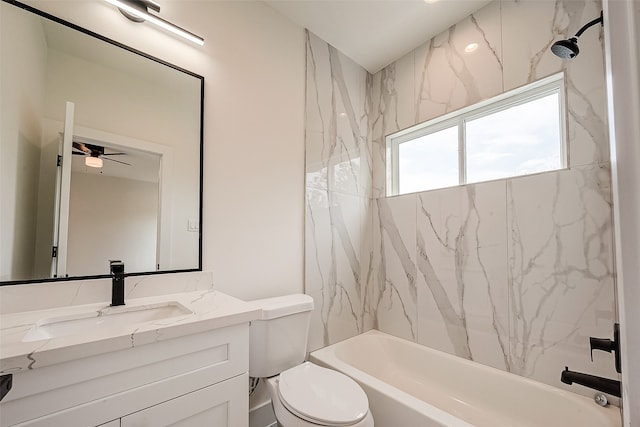 full bathroom with ceiling fan, vanity, tiled shower / bath combo, and toilet