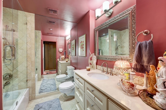 bathroom featuring tile patterned floors, toilet, and vanity