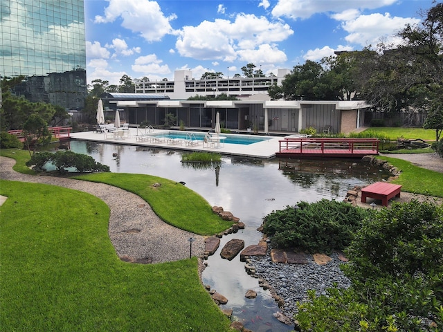 exterior space featuring a yard and a pool