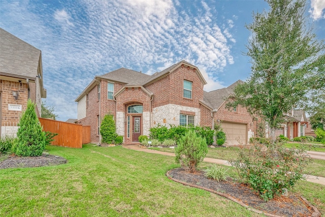 view of front of home featuring a garage and a front lawn