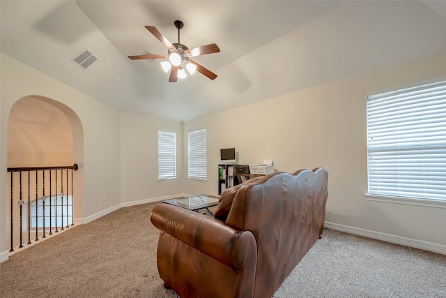 carpeted living room featuring lofted ceiling, a healthy amount of sunlight, and ceiling fan