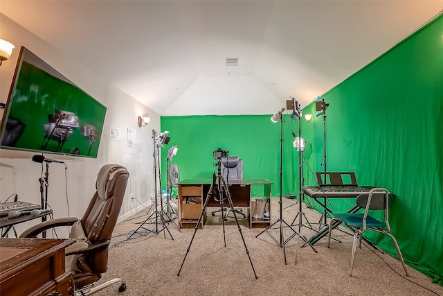 home office featuring lofted ceiling and carpet