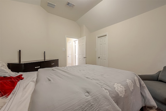 bedroom featuring lofted ceiling