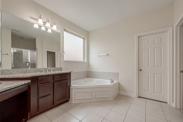 bathroom featuring vanity, tile patterned floors, and plus walk in shower