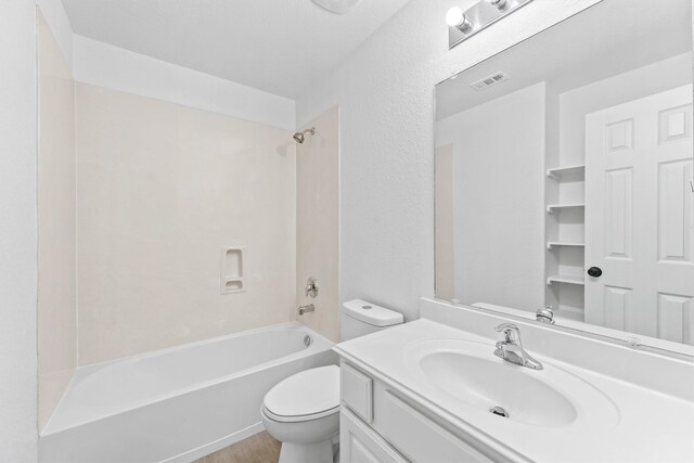 bathroom featuring toilet, shower / bathing tub combination, vanity, and visible vents