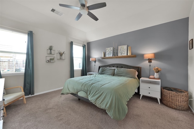 bedroom featuring ceiling fan, vaulted ceiling, and carpet floors