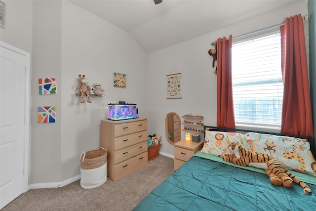 bedroom featuring vaulted ceiling and carpet