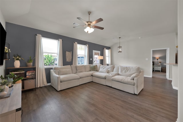 living room featuring dark wood-type flooring, vaulted ceiling, and ceiling fan