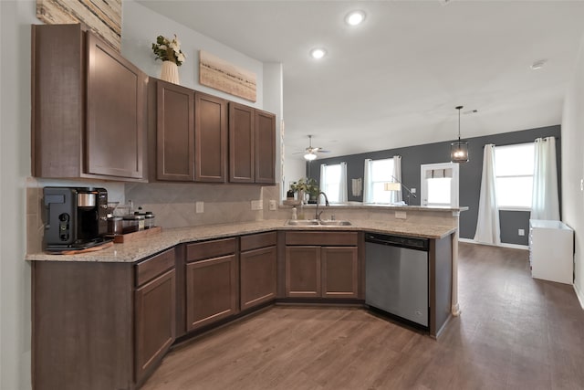 kitchen with kitchen peninsula, sink, ceiling fan, dark hardwood / wood-style floors, and stainless steel dishwasher