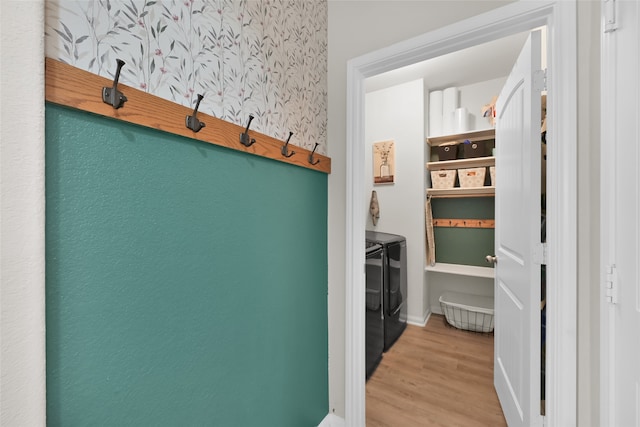 interior space with washer and dryer and light hardwood / wood-style floors