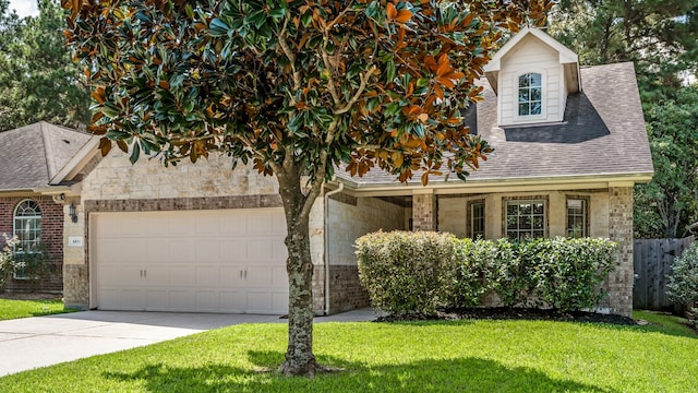 view of front of property with a front lawn and a garage