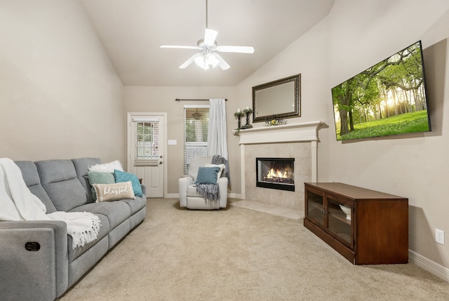 living room featuring light carpet, ceiling fan, high vaulted ceiling, and a fireplace