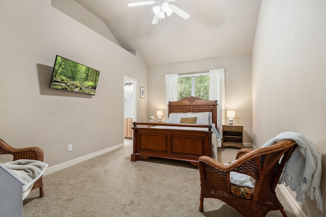 carpeted bedroom featuring vaulted ceiling, ceiling fan, and ensuite bathroom