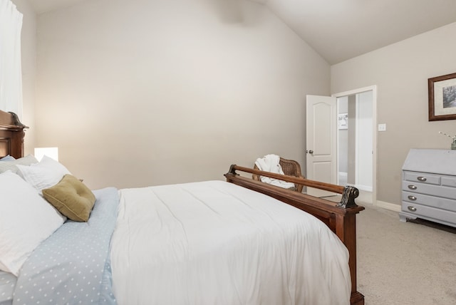 bedroom featuring carpet flooring and vaulted ceiling