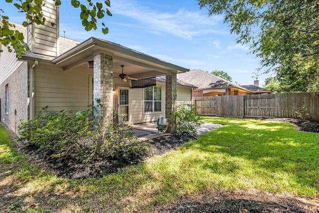 exterior space featuring ceiling fan and a patio area