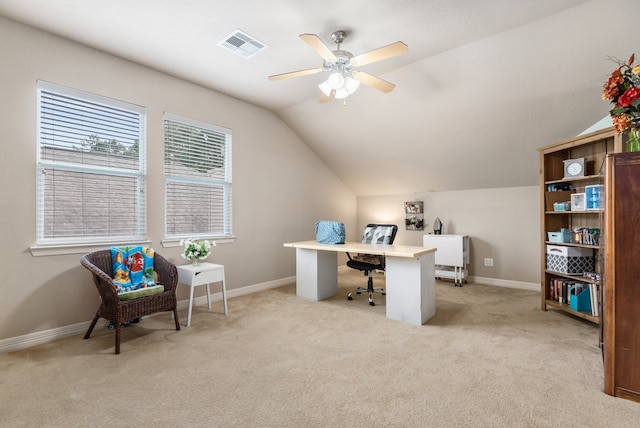 carpeted home office with lofted ceiling and ceiling fan