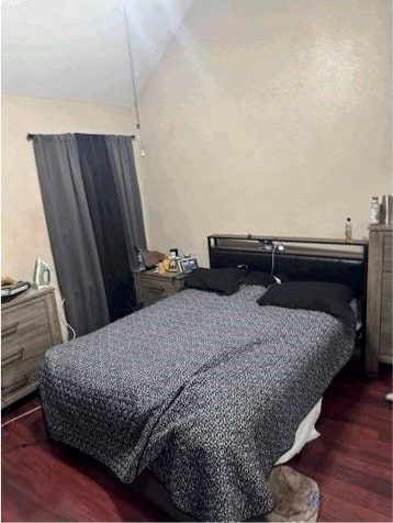 bedroom featuring dark hardwood / wood-style floors