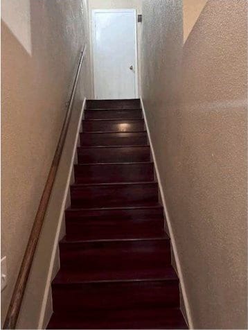 stairway featuring hardwood / wood-style floors