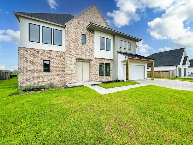 view of front of home featuring a garage and a front yard