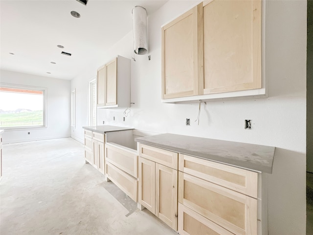 kitchen featuring light brown cabinetry