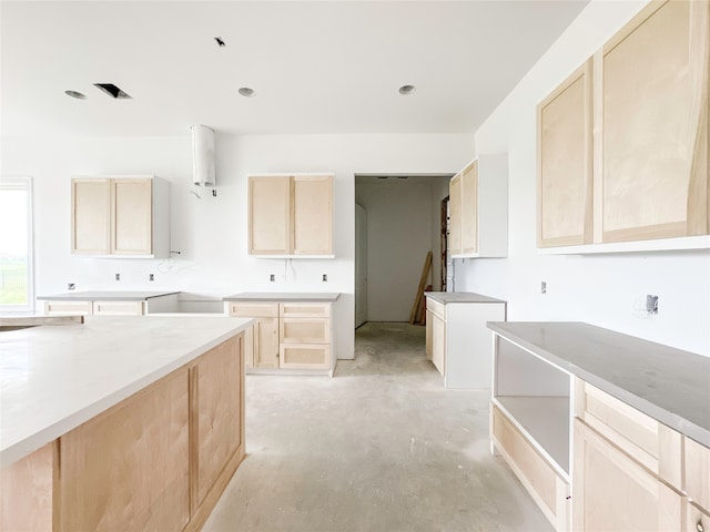 kitchen featuring light brown cabinetry