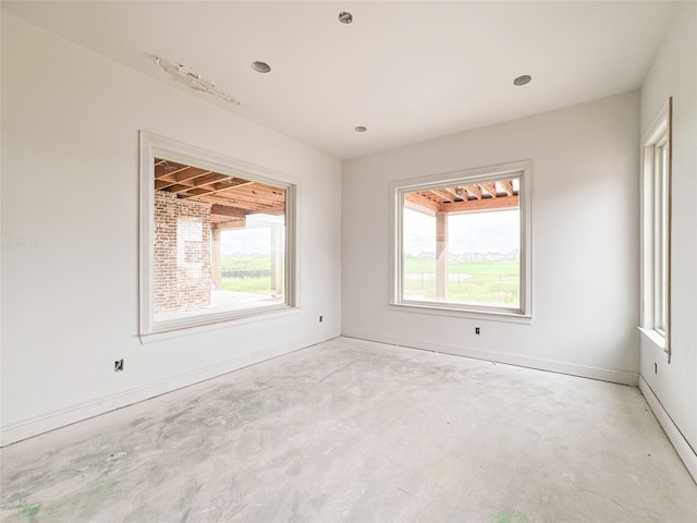 spare room featuring plenty of natural light