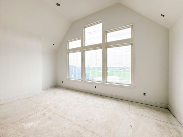 bonus room featuring lofted ceiling and a healthy amount of sunlight