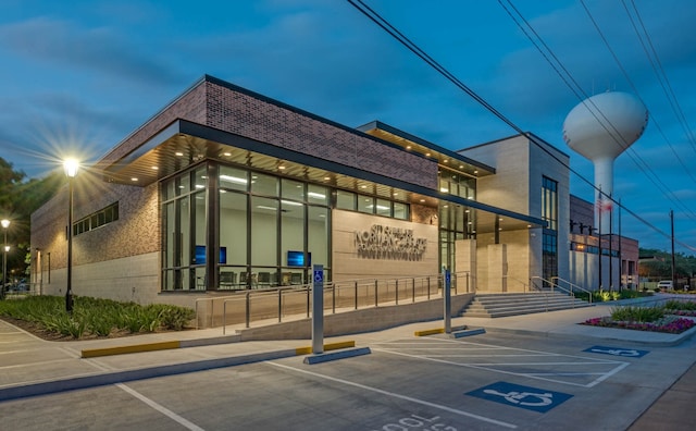 view of outdoor building at dusk