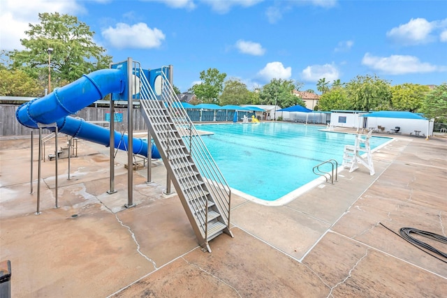 view of pool featuring a playground