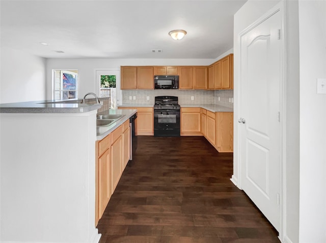 kitchen featuring black appliances, backsplash, sink, and dark wood-type flooring