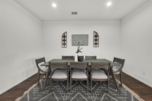 dining area with dark hardwood / wood-style floors