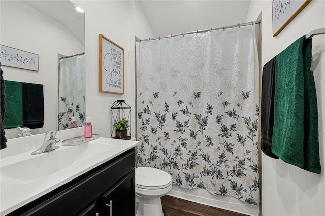 full bathroom featuring vanity, toilet, shower / tub combo with curtain, and hardwood / wood-style floors