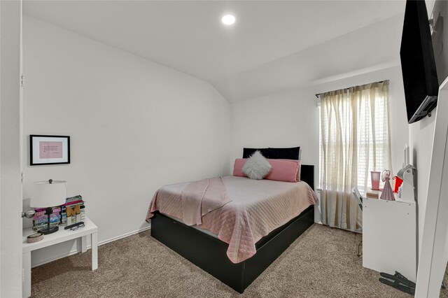 carpeted bedroom with vaulted ceiling