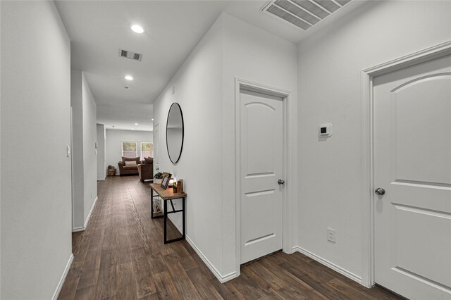 corridor with dark wood-type flooring