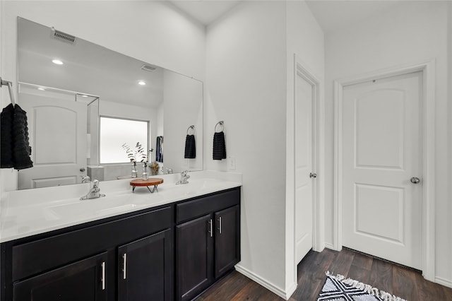 bathroom with vanity and hardwood / wood-style floors