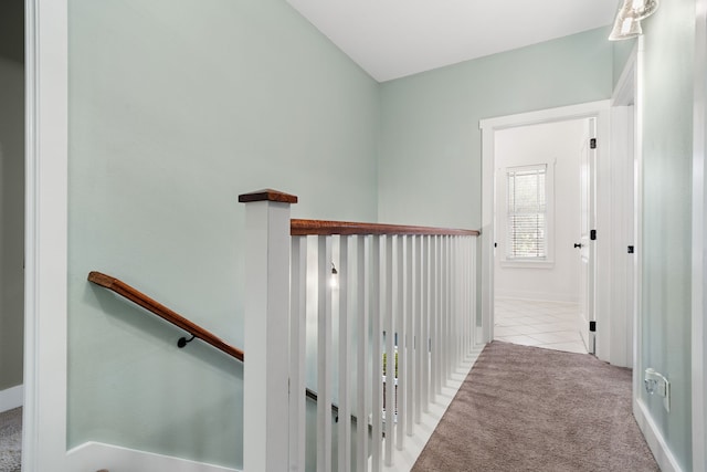 hallway featuring light carpet