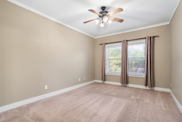 unfurnished room featuring crown molding, ceiling fan, and light carpet