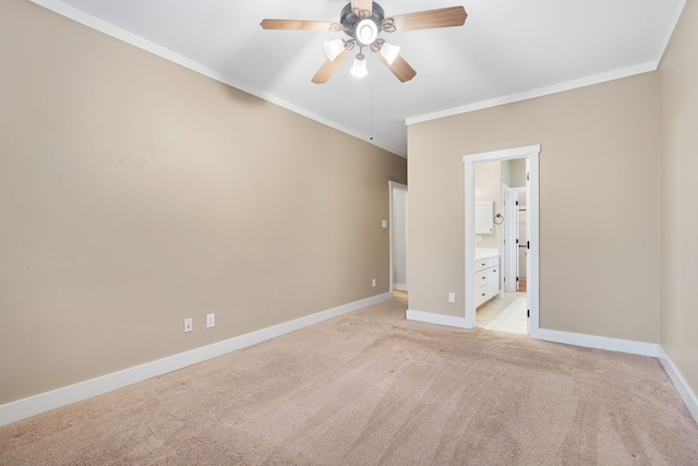 unfurnished bedroom featuring ensuite bathroom, ceiling fan, light carpet, and ornamental molding