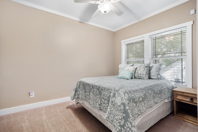 bedroom with carpet, ceiling fan, and ornamental molding