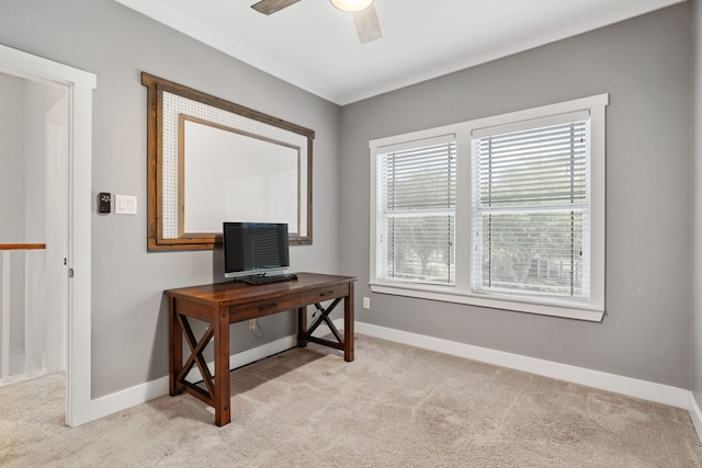 carpeted office space with ceiling fan