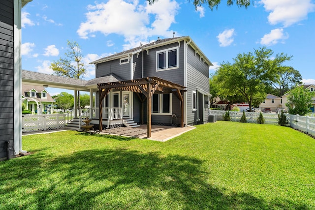 back of house with a yard, a pergola, and central AC